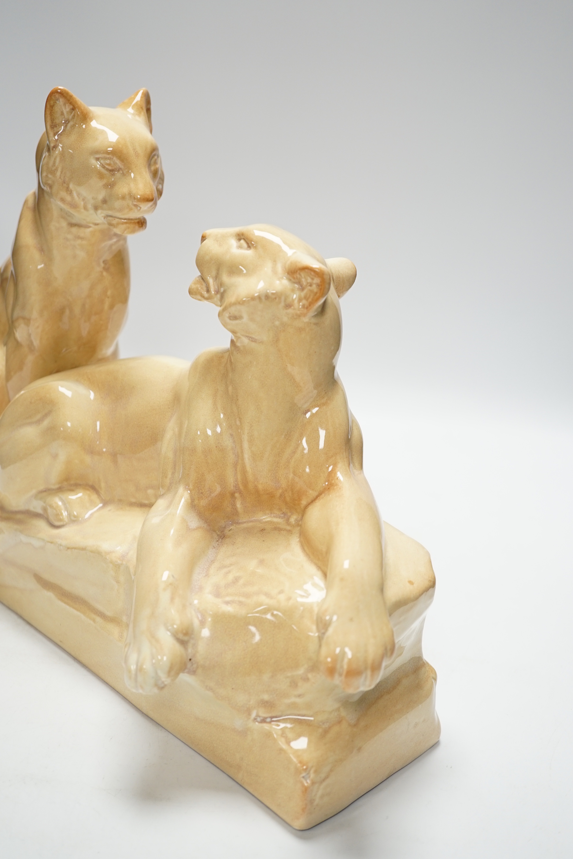 An Art Deco porcelain panther group, signed odyv, 45cm